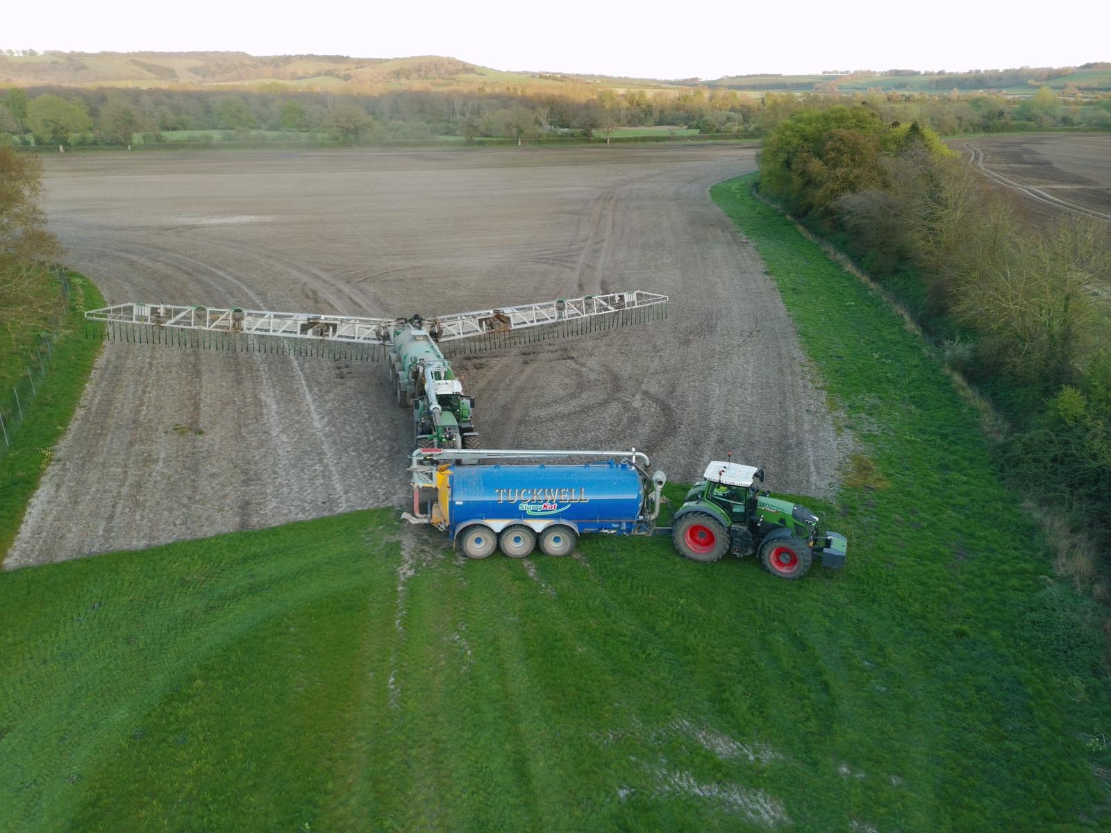Drip hose boom slurry application working in the field
