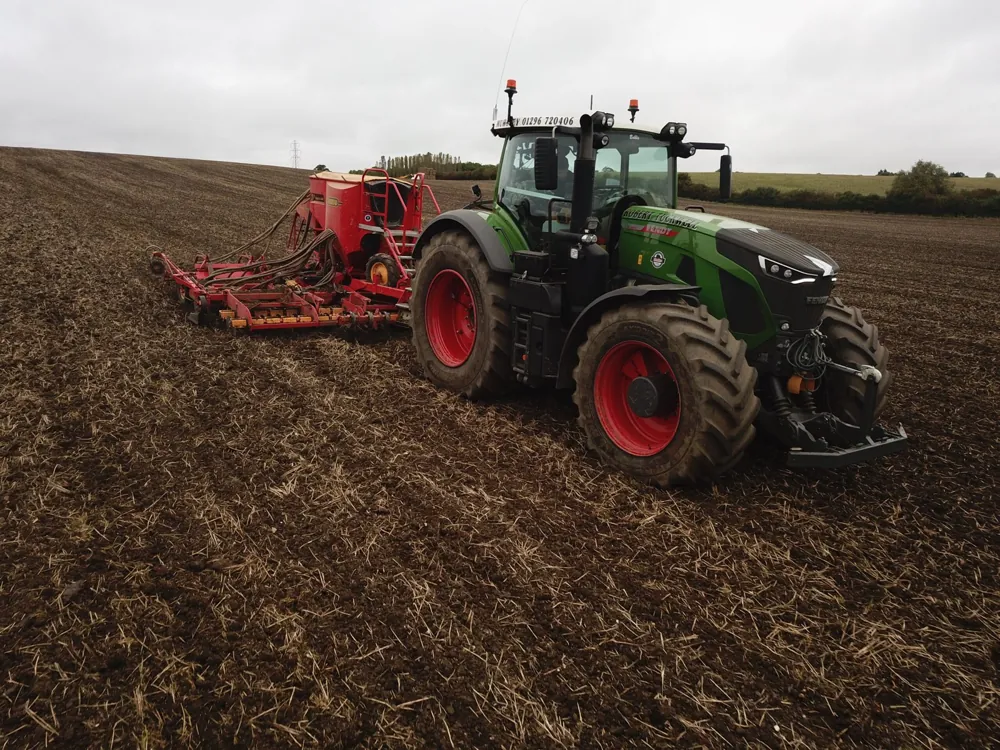 Robert Tuckwell tractor and seed drill on cultivated ground